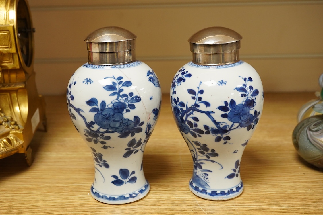 A pair of Chinese white metal mounted blue and white vases, Kangxi period (1662-1722), 16.5cm